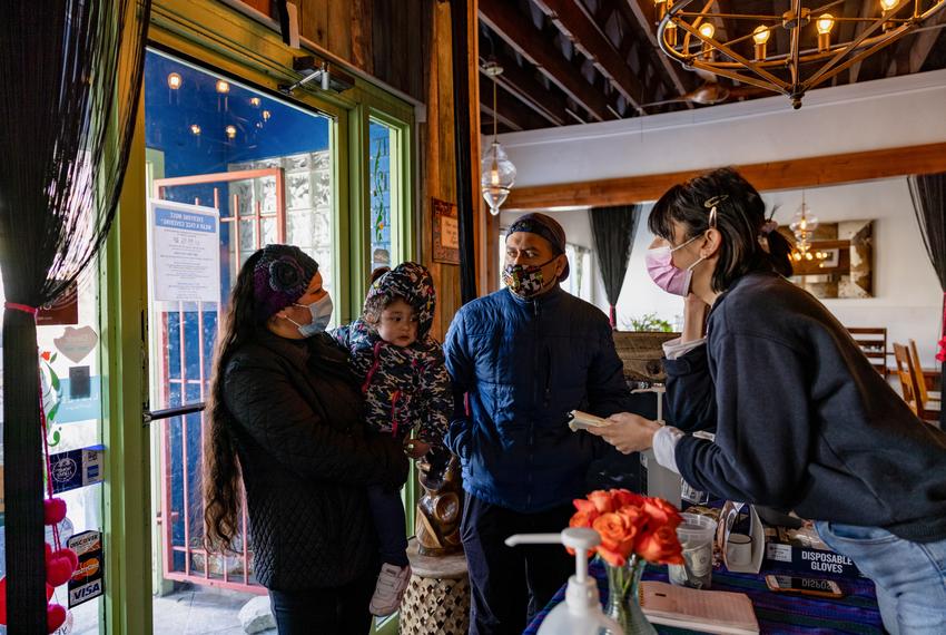 The hostess takes the order of the Baltazar family at Cafe Buenos Aires in East Austin on Feb 19, 2021. The cafe had two menu items for customer to choose from for their free meal.